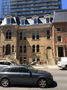 Row of Toronto buildings with mansard slate roofs