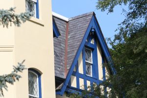 Slate roof with a copper open valley installation detail and copper snowguards