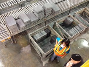 Employee sorting thru the various slate roof tile thicknesses