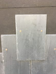 Sample of where nail holes are located on a piece of slate