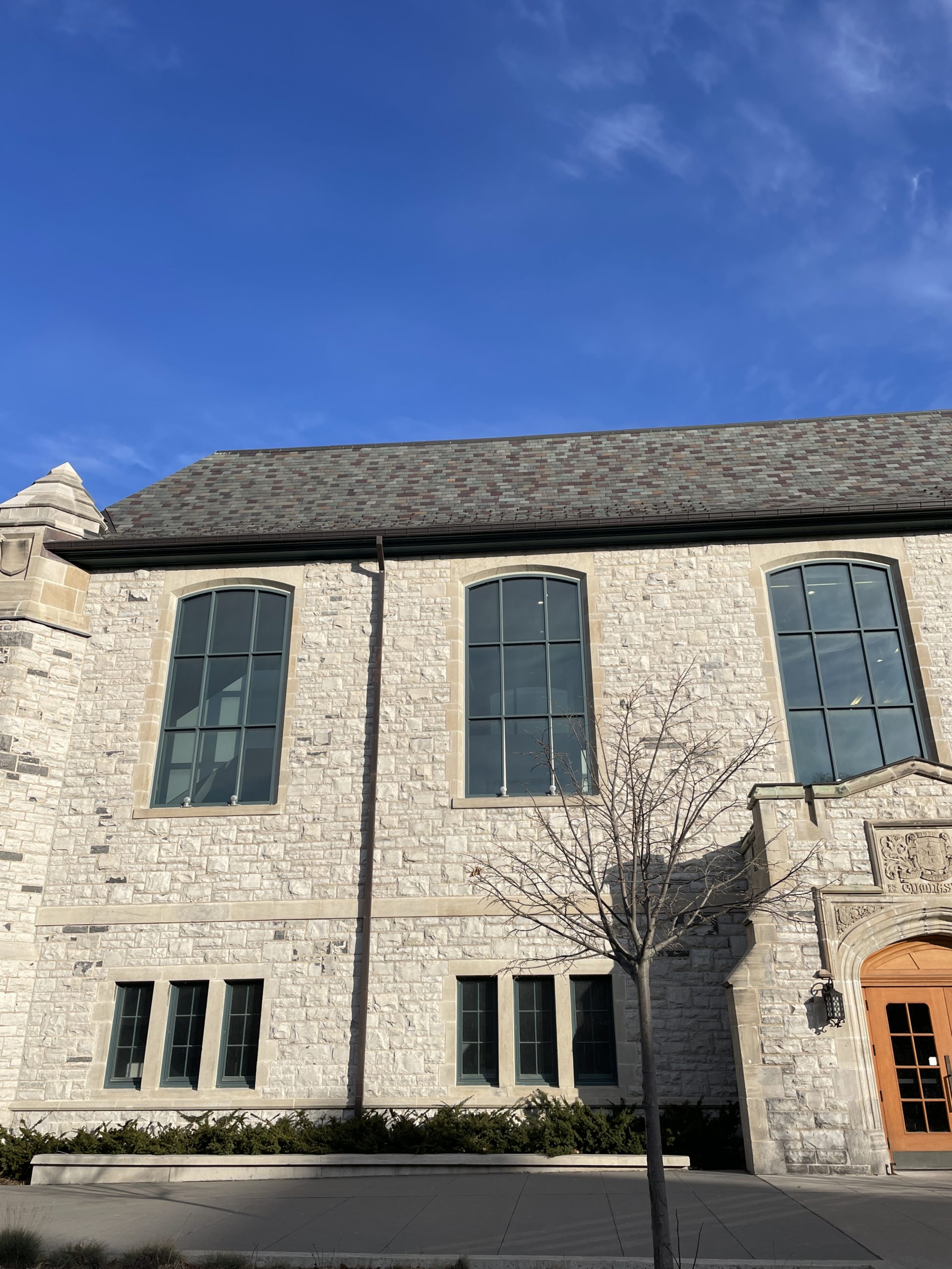 This roof features a blend of Unfading purple, Unfading Green, Mottled Purple & Green, and Semi-Weathering Gray Green roofing slate